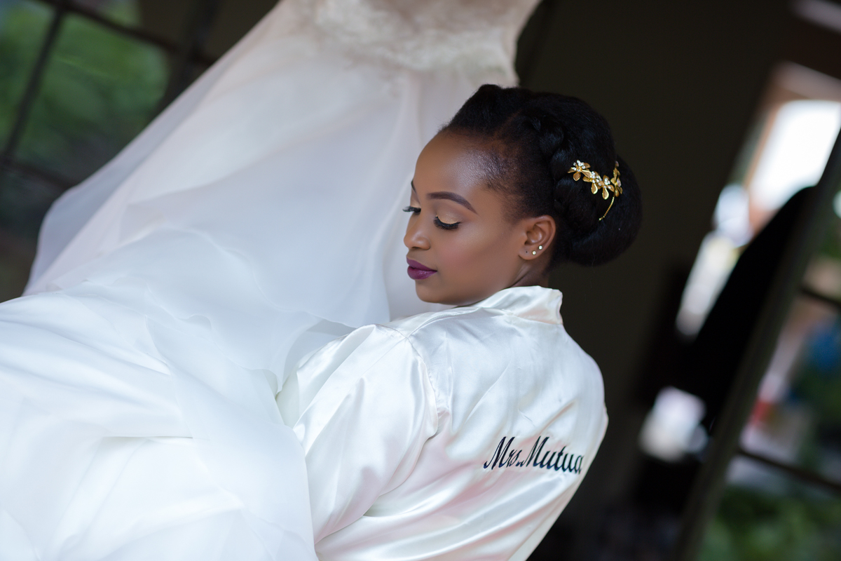 Kenyan Beautiful Bride Admiring Her Beautiful Gown Dress - Antony Trivet Photography